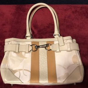 Shades of white and tan Coach bag.